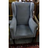 Edwardian Wingback Armchair, on high turned legs and castors, blue velour fabric