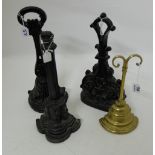 Three 19thC Cast Iron Door Stops painted black and a brass door stop (4)