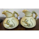 Similar Pair of Royal Worcester Water Jugs, beige ground with green and gold handles, mounted with