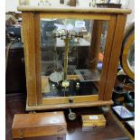 Laboratory Scales (by George of Birmingham) in oak case, with two cased sets of miniature brass