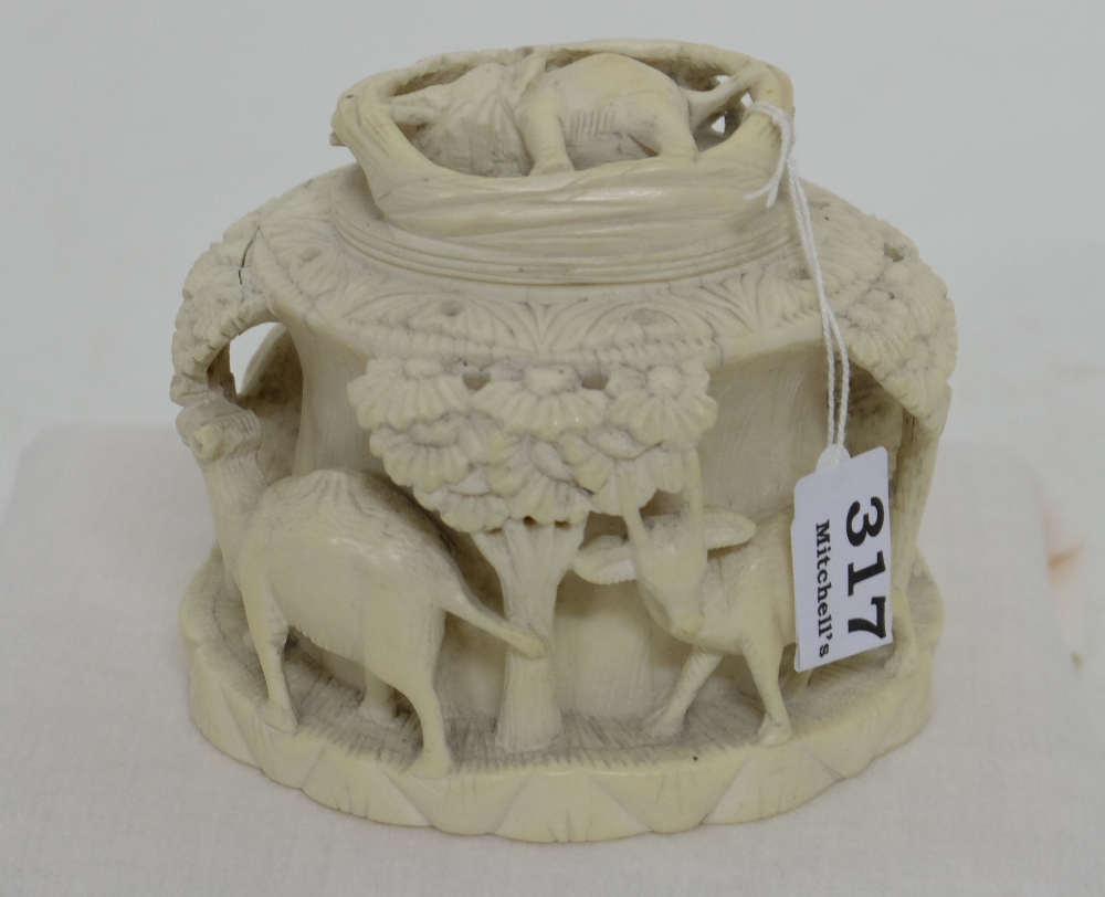 19th C Oval Ivory Caddy with lid, decorated in relief with continuous wild animal figures – lions,