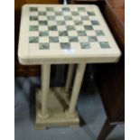Beige Marble Occasional Table with chess board decorated top, on 4 turned columns and platform base,