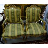 Matching Pair of Gilt Framed Armchairs, the carved top rails decorated with stylized flowers and