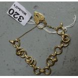 9ct Gold Lady’s Bracelet, the circular links joined by impressed gold bands, (each link stamped)