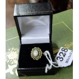 9ct Gold 1930’s Lady’s Ring, a central opal surrounded by emerald pastes