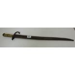 Bayonett in metal sheath, with ribbed brass handle, 28”long