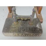 19thC cast iron boot scraper, in later concrete base engraved “Museum, S. Lawlor”.