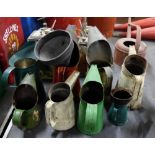 8 tin oil cans (various colours) & 2 funnels