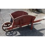 Irish Wooden Farm Barrow, with steel wheel, original red paint, 68” long