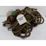 Long length old fishing rope, buoy and two rope pullies