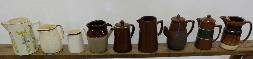 9 creamware pottery jugs – 6 brown (1 old Denby) & 3 cream (9)