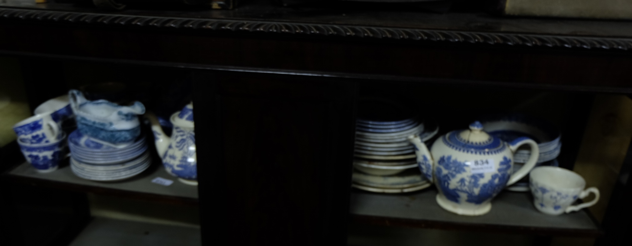 Shelf of china – mainly blue and white, cups, saucers, tea plates etc