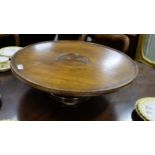 Round Late 19thC mahogany “Lazy Suzy”, on swivel base, rimmed borders with central well, 21”dia