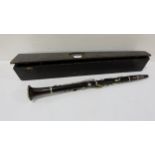 Early to mid-20thC ebony handled Clarinet (26”l) with plated mounts, with original wooden carrying