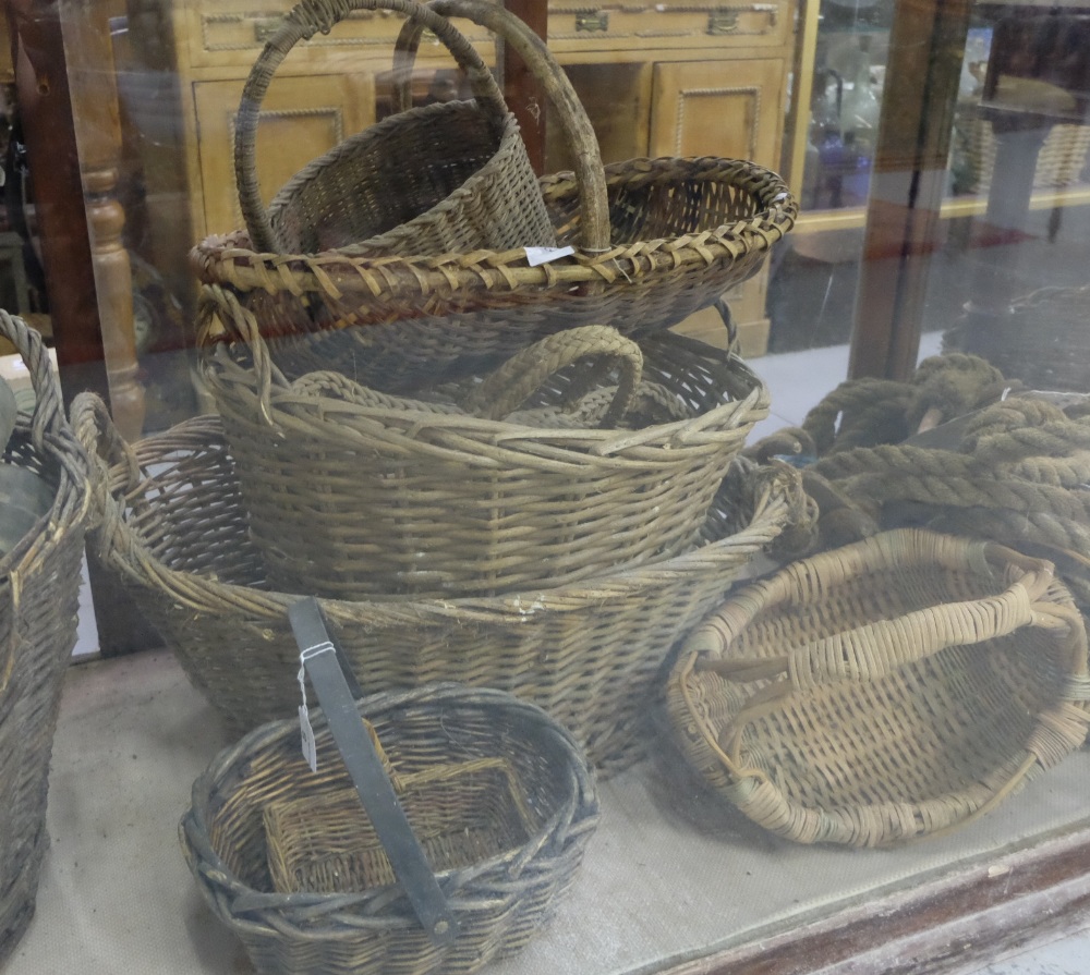9 old wicker baskets, with handles.