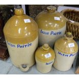 4 stoneware Whisky Jars, various sizes, marked in blue “Irish Poitin” (handles damaged)