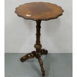 Walnut occasional/lamp table, with shaped top over naturalistic tree branch base, 18” dia, 30”h