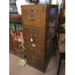1930's EUROPEAN oak office filing cabinet with four drawers and locking bar.