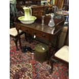 Victorian mahogany wash stand the gallery back above two drawers raised on turned and tapering legs.