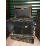 Three Victorian travel trunks.