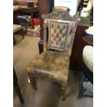 Victorian carved oak side chair with leather upholstery.