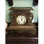 19th. C. polished metal mantle clock.