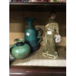 Ceramic figure of a monk a bowl and jug.
