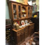 Pine dresser the superstructure with two shelves and two drawers flanked by four glazed doors above