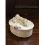 2nd Period Belleek soap dish surmounted with a reclining cherub. Stamp faded.