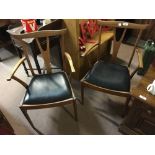 Pair of Eircol open armchairs.