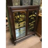 Sign painted gentlemans outfitters cabinet.