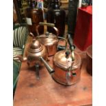 Two copper electric kettles and a coffee pot.