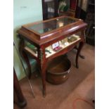 Victorian inlaid mahogany display table with brass mounts.