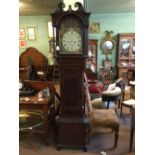 Early 19th. C. Inlaid mahogany long cased clock with painted arched dial.