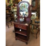 Mahogany dressing table with mirrored back.