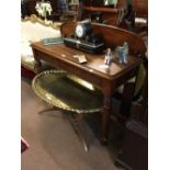 William IV. Mahogany side table with gallery back raised on octagonal tapering legs.