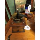 Brass and wood coffee grinder.