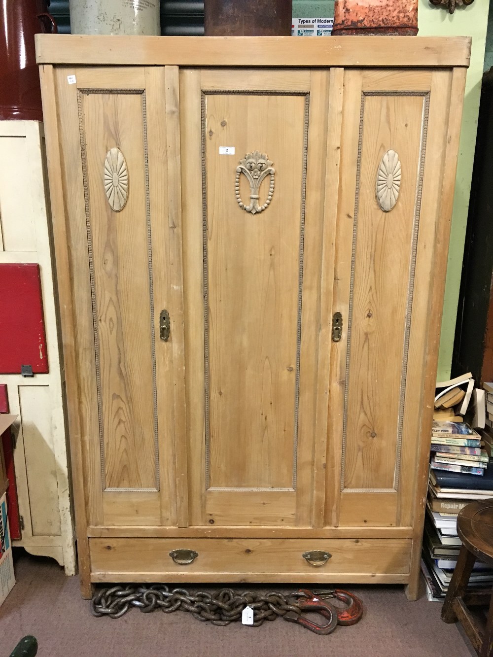 19th. C. stripped pine robe with three doors.