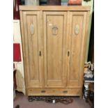 19th. C. stripped pine robe with three doors.