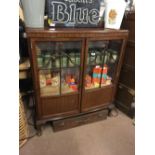 Edwardian mahogany display cabinet with two glazed and panelled doors raised on Queen Ann legs.