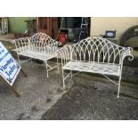 Pair of wrought iron garden seats.