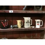 Collection of advertising jugs, ice bucket and optics.