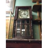 1930's mahogany wall clock with silvered dial.