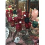 Seven pieces of ruby glass and two pieces of green glass.