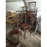 Set of fifteen metal and wooden café chairs.