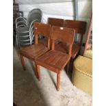 Four oak kitchen chairs.