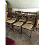 Set of six mahogany and brass inlaid dining chairs.