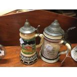 Early C20th German beer stein and German musical beer stein.