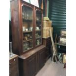 C19th. mahogany library bookcase with two glazed doors over two panelled doors.