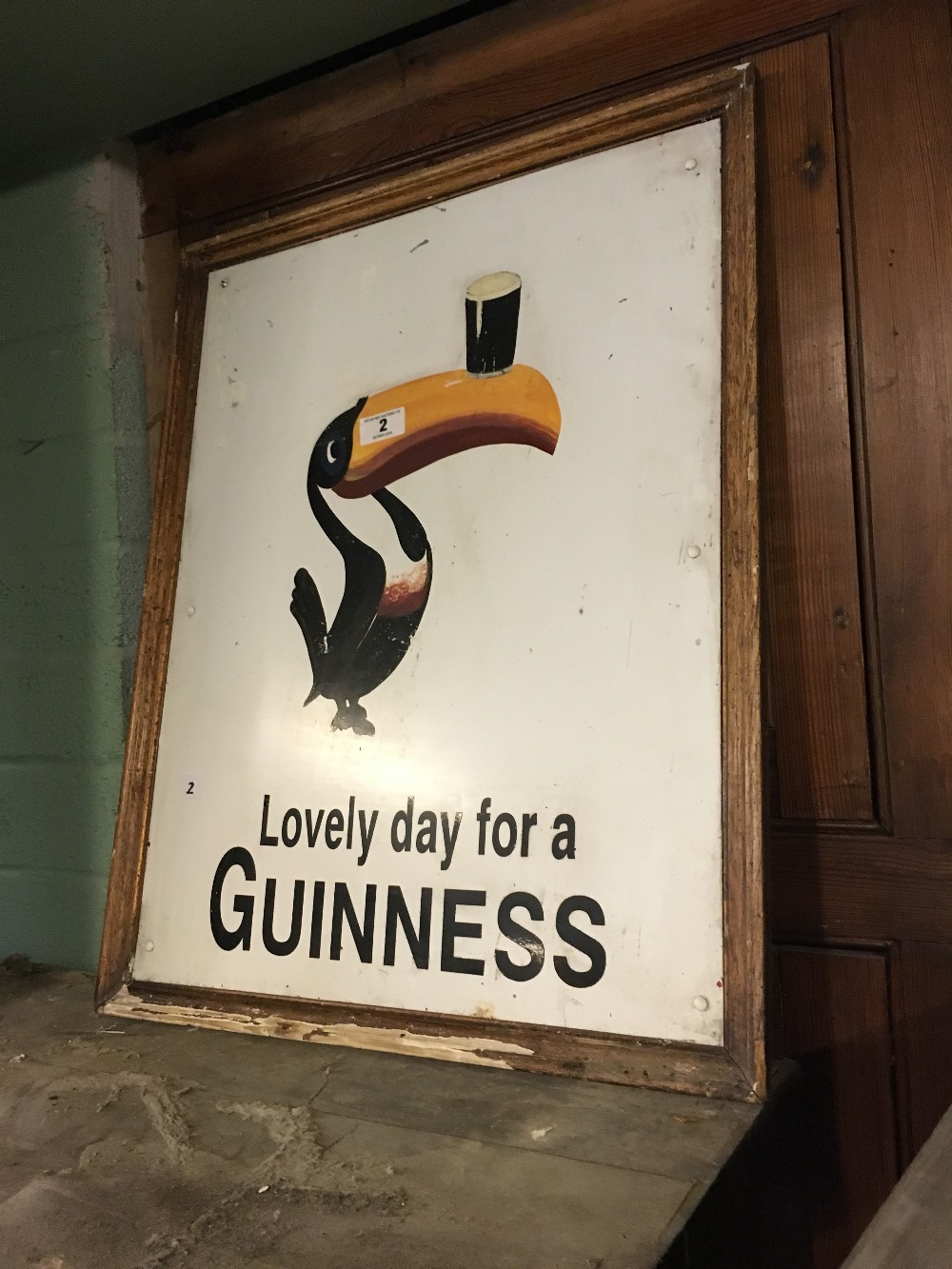 Unusual framed "Lovely day for a Guinness" toucan advertisement sign.